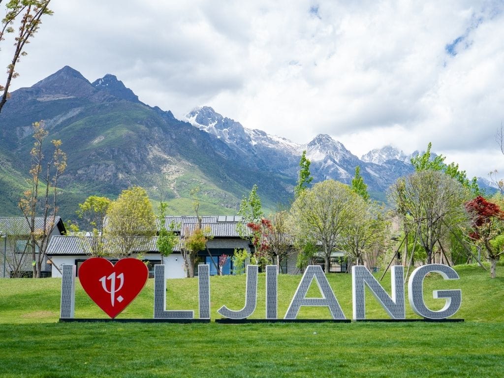 "I Love Lijiang" sign with the Jade Dragon Mountain in the background