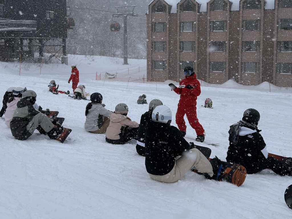 Club Med Ski Holiday 2027: Group snowboard lesson for beginners at a Club Med resort in Japan